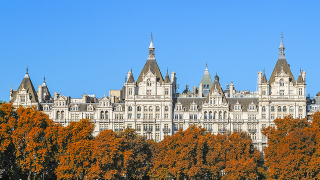 The impressive facade of The Royal Horseguards hotel in Westminster on a clear autumn day with blue skies.