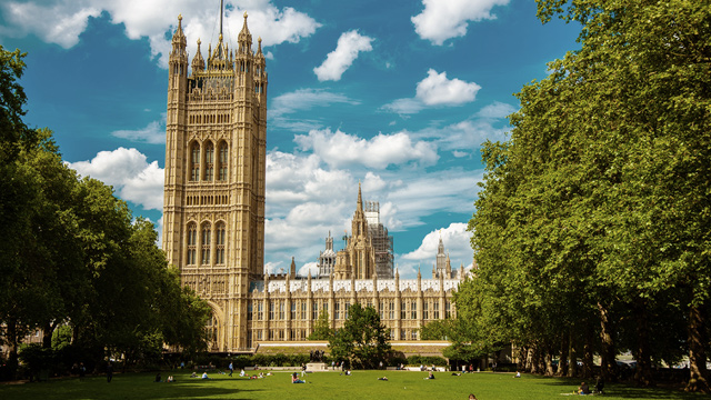 London's Palace of Westminster viewed from Abingdon Street Gardens.
