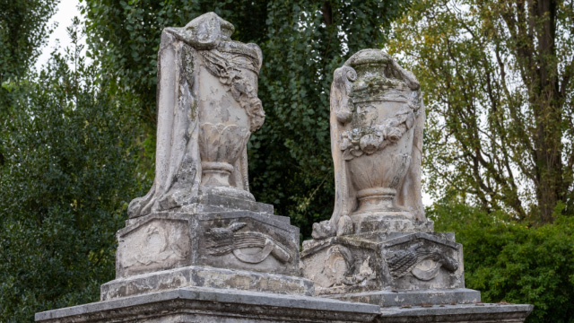 Two Victorian-era gravestone urns at Willesden Jewish Cemetery in London