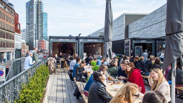 Enjoy food from the many vendors at Boxpark Shoreditch. Image courtesy of Boxpark Shoreditch.
