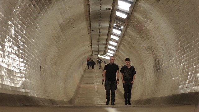 Greenwich Foot Tunnel. Image courtesy of Ed Simmons/Visit Greenwich. Two men walking through Greenwich Foot Tunnel.