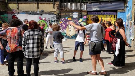 Follow your specialist street art tour guide as you explore the streets of Shoreditch and Brick Lane. Image courtesy of Golden Tours.