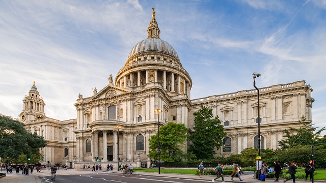 landscape photo of st paul's cathedral, with a cloudy blue sky in the background