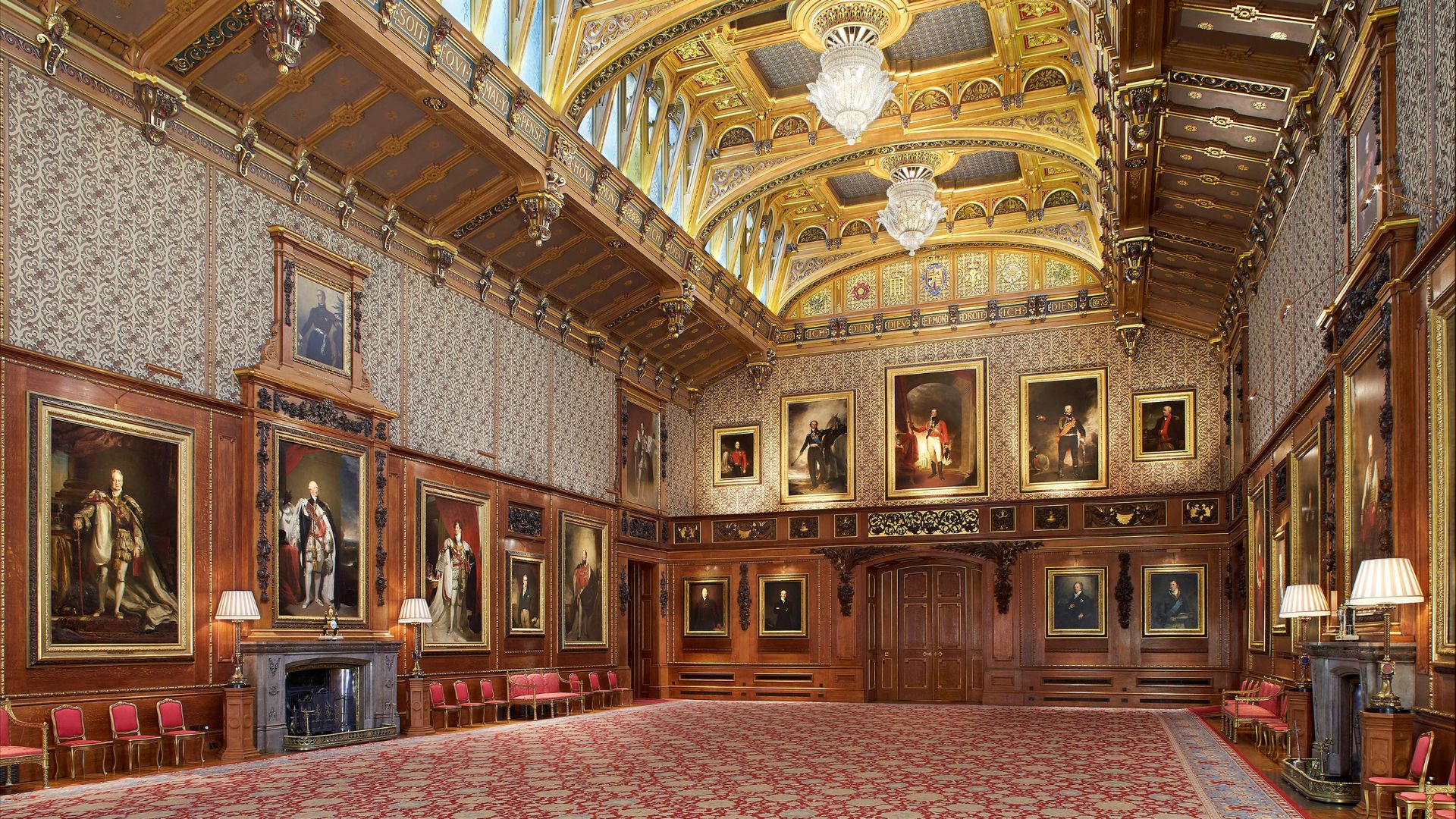 Discover hidden treasures in the Waterloo Chamber at Windsor Castle. © Royal Collection Enterprises Limited 2025 | Royal Collection Trust. Photo credit: Peter Smith A grand room filled with paintings and a high ceiling of gold in windsor castle.