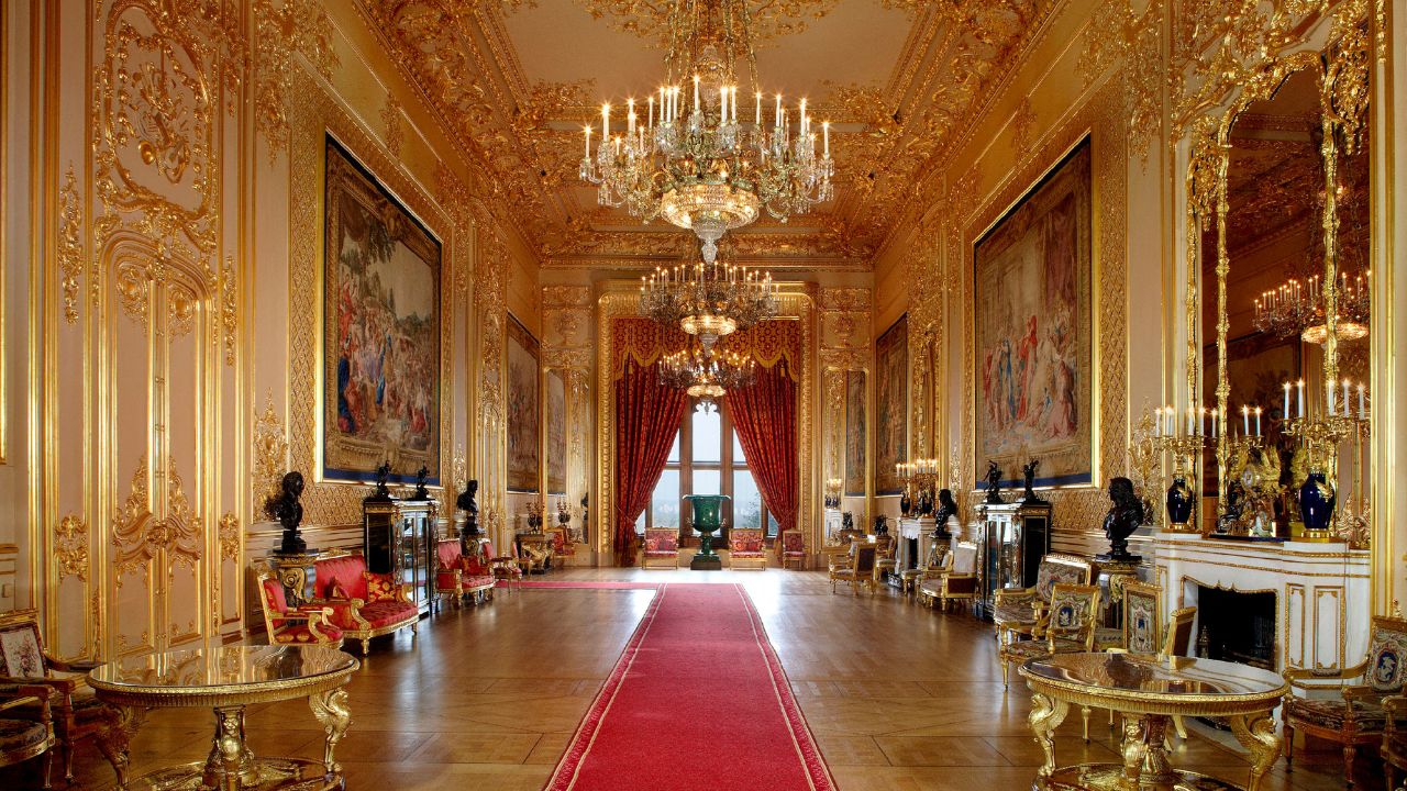 The gold and red grand reception room at windsor castle.