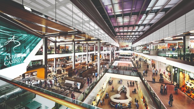 Have a big shopping day out at Westfield's two London locations. Image courtesy of Westfield. Birds-eye-view of the interior of a modern shopping mall showing many people walking between shops and the glass fronts of retail outlets.