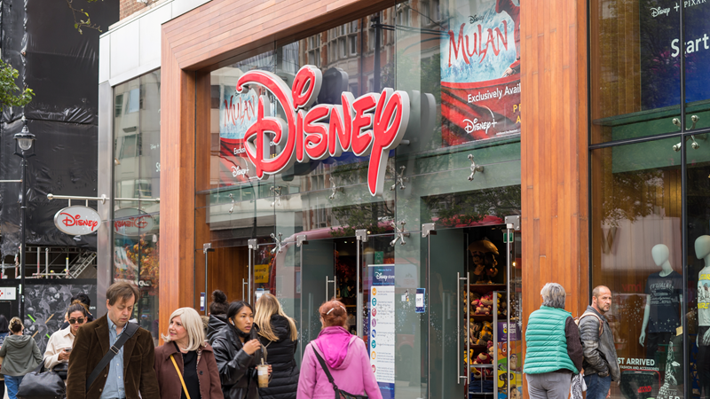 Find iconic Disney-themed gifts and souvenirs in the form of cuddly toys and memorabilia. Credit: Shutterstock. Image courtesy of Shutterstock. A view of the Disney Store on Oxford Street from outside with people walking in front of it and the giant red Disney sign above the doors
