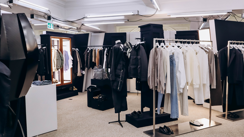 Find all the latest big names in luxury fashion and streetwear at Dover Street Market. Credit: Shutterstock. Image courtesy of Shutterstock. Three rails of clothes at Dover Street Market featuring blazers in hues of white, brown and black, jeans and bomber jackets