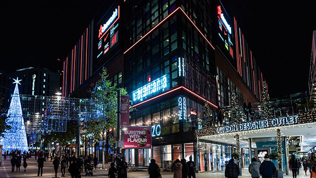 London Designer Outlet Wembley © Coverdale Barclay. Image courtesy of Coverdale Barclay. The exterior of the shops illuminated at the London Designer Outlet Wembley at night time