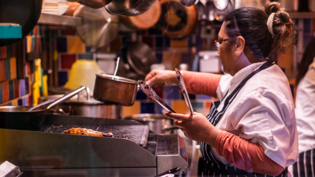 Food being cooked by a chef in a kitchen in Brixton