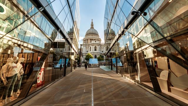 Shop with incredible views of St Paul's Cathedral at One New Change. Image courtesy of Antoine Buchet/Visit London. A view towards St Paul's Cathedral taken between two reflective glass walls at One New Change.