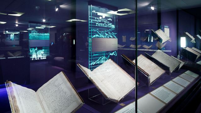 Books behind glass on the treasures tour at the British Museum.