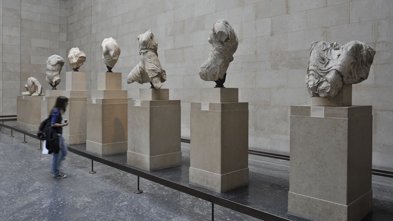 The Duveen Gallery at the British Museum. Image courtesy of the British Museum. A visitor observing a collection of 7 sculptures displayed in the Duveen Gallery at the British Museum in London.