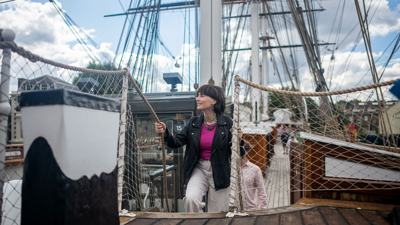 Discover what life at sea was like when exploring the Cutty Sark, the iconic ship docked in Greenwich. © visitlondon.com/Michael Barrow A woman is climbing the stairs to reach the top deck of the Cutty Sark, the iconic ship docked in Greenwich.