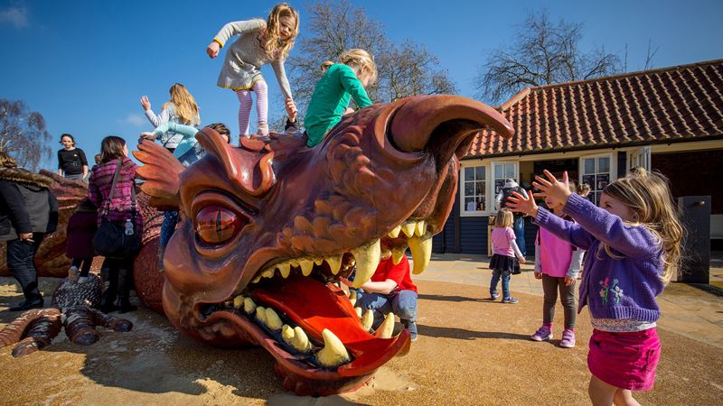 Let little ones' imagination run wild at Hampton Court's family-friendly Magic Garden. Credit: Historic Royal Palaces. Image courtesy Historic Royal Palaces. Children playing on the dragon at The Magic Garden, Hampton Court