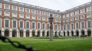 Peak into the Fountain Court at Hampton Court Palace and its recogniseable red and white facade.
