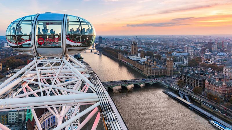 Enjoy 360-degree views of London's epic skyline from the London Eye. Credit: Jon Reid. Image courtesy of Visit London. View of London including the Thames and Big Ben from the London Eye with a capsule in the foreground.