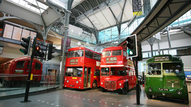 Inside the London Transport Museum. Image courtesy of the London Transport Museum. Two red and one green bus on display at London Transport Museum.
