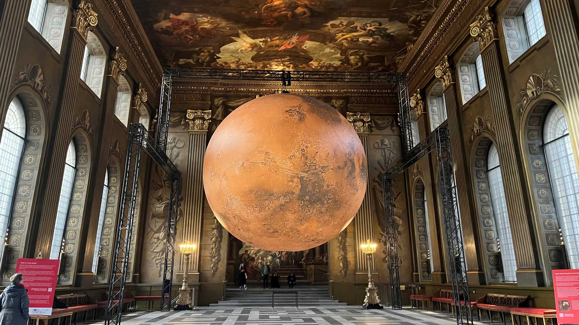 Don’t miss the chance to see Mars in the Painted Hall at the Old Royal Naval College. © Visit London/Charlotte Pritchard. Installation of the planet Mars suspending from the celling in the Painted Hall.