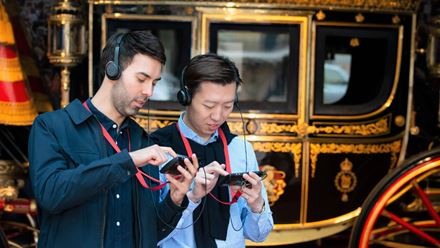 Listen to an audio guide as your explore the Royal Mews. Image courtesy of Golden Tours / Royal Collection Trust © His Majesty King Charles III 2024