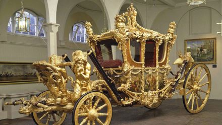 The Gold State Coach at the Royal Mews. Image courtesy of Golden Tours / Royal Collection Trust © His Majesty King Charles III 2024.