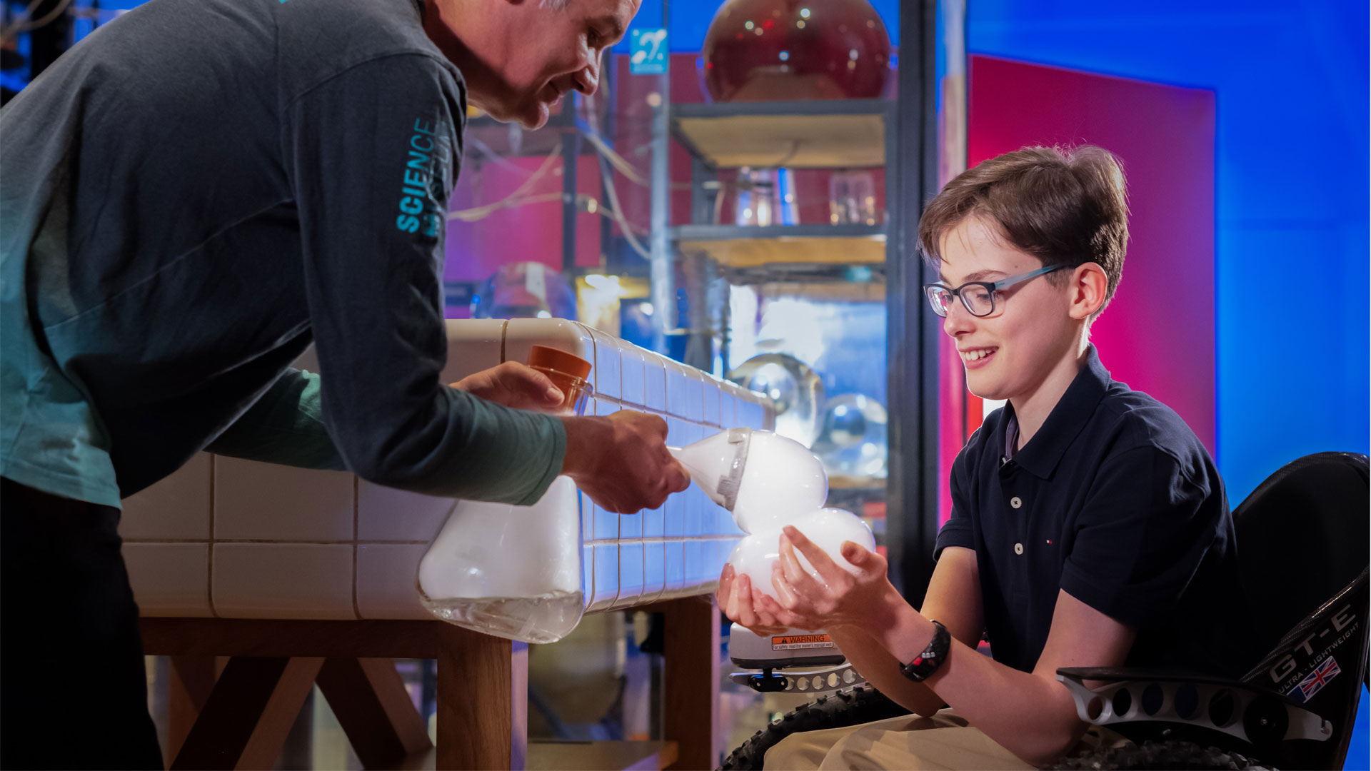 Wonderlab at the Science Museum. Image courtesy of the Science Museum Group. Engineer carrying out a dry ice demo with visitor at the Science Museum. Image courtesy of the Science Museum Group.