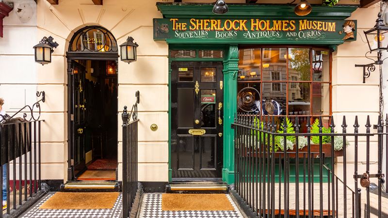 Step inside The Sherlock Holmes Museum at 221b Baker Street. Credit: Shutterstock. Image courtesy of Shutterstock. The green shop front of the Sherlock Holmes Museum at 221b Baker Street in London.