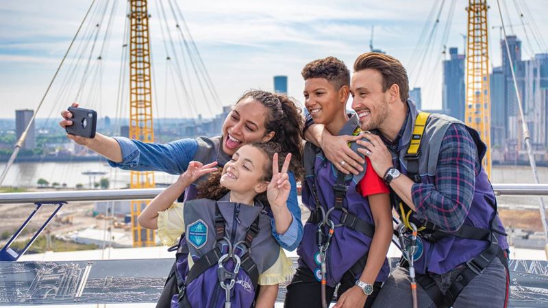 Put your double agent skills to the test and scale the O2 for striking skyline views. Credit: Up at The O2. Image courtesy of Up at The O2. Family of four take a selfie on top of the O2 stadium in london.