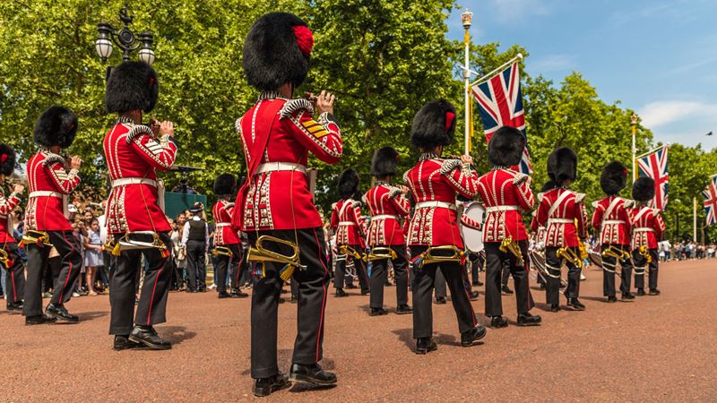 Witness the pomp at Trooping the Colour. Credit: Shutterstock. Image courtesy of Shutterstock. Military parade of troops from the Household Division honouring the King's official birthday during Trooping the Colour in London.