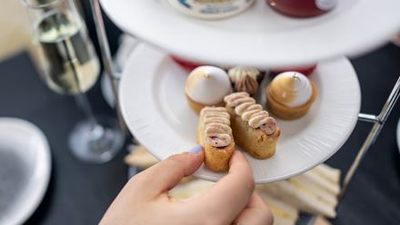 Enjoy an array of finger sandwiches and fresh scones as you take in London's famous landmarks on City Cruises' afternoon tea cruise. © London & Partners/Michael Barrow