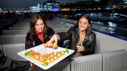 Tuck into canapes while you soak up London's skyline from the water on an evening cruise with City Cruises. Image courtesy of City Cruises.