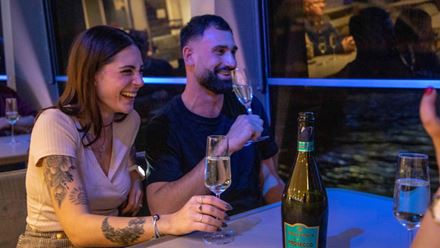 Sip on a glass of bubbles from the comfort of your seat as you soak up the sights on an evening cruise on the Thames. Image courtesy of City Cruises.