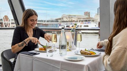 Savour a delicious meal on the City Cruises lunch cruise on the river Thames. Image courtesy of City Cruises.