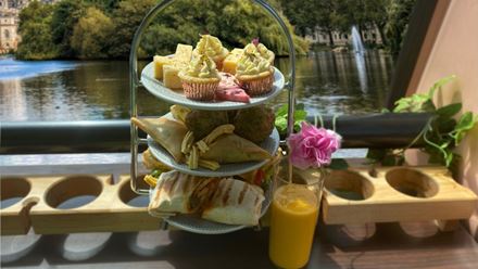 Enjoy traditional Indian snacks and sweet treats on board a high chai afternoon tea bus tour. Image courtesy of Golden Tours.