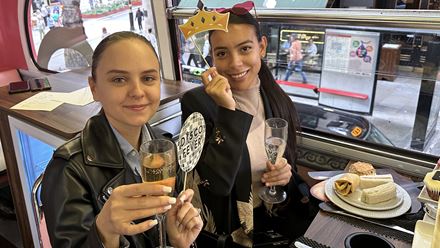 Tuck into treats while driving past the city's best sights on the musical afternoon tea bus tour of London. Image courtesy of Golden Tours.