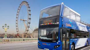 Hop-on hop-off bus driving past the London Eye.
