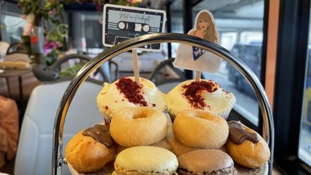 Satisfy your sweet tooth at a Taylor Swift-inspired afternoon tea bus tour in London. Image courtesy of Golden Tours