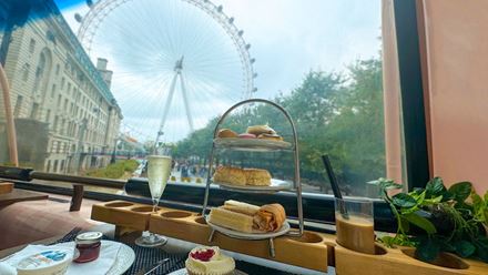Enjoy picture-perfect views of London landmarks while tucking into an afternoon tea. Image courtesy of Golden Tours