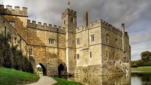 Outside wall of Leeds Castle on a cloudy day.