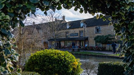 Visit the Cotswold villages, a picture perfect english countryside landscape. Image courtesy of Simon Godfrey on Unsplash.