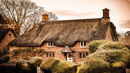 Visit the quaint villages of The Cotswolds and admire charming towns and their pretty cottages. Image courtesy of Liv Cashman on Unsplash