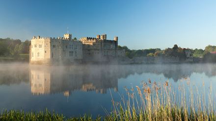 Mist hangs on the surface of the moat surrounding the historic Leeds Castle. Image courtesy of Golden Tours. Photo credit: Sarah Medway