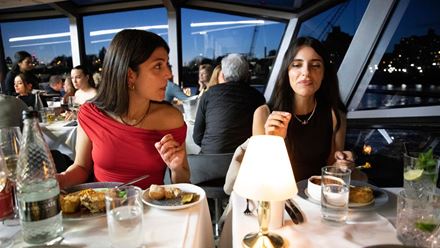  Jump on board a London dinner cruise and savour a four-course meal with friends. Image courtesy of Golden Tours.