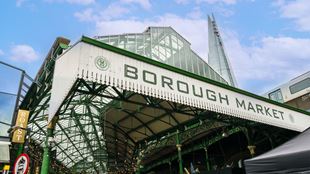 Exterior and sign of Borough Market with the Shard in background.