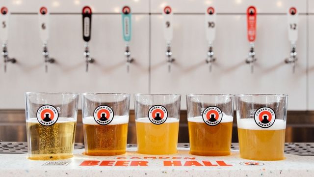 A flight of beers from Camden Town Brewery. Image courtesy of Golden Tours. A collection of five different beers from camden town brewery.