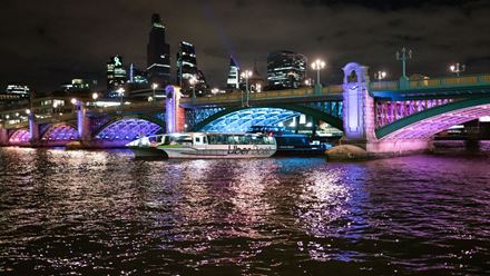 See London's bridges lit up at night on a river cruise. Image courtesy of Golden Tours.