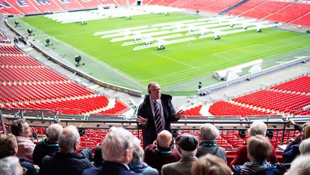 Listen to fun facts about Wembley Stadium from an expert guide. Image courtesy of Golden Tours.