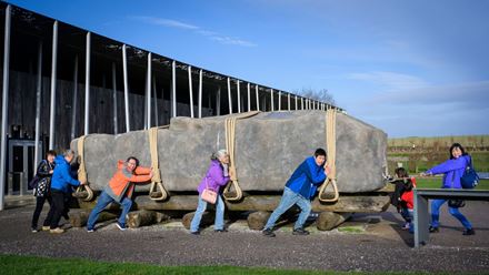 See if you can move the giant stone! Image Credit: English Heritage Trust