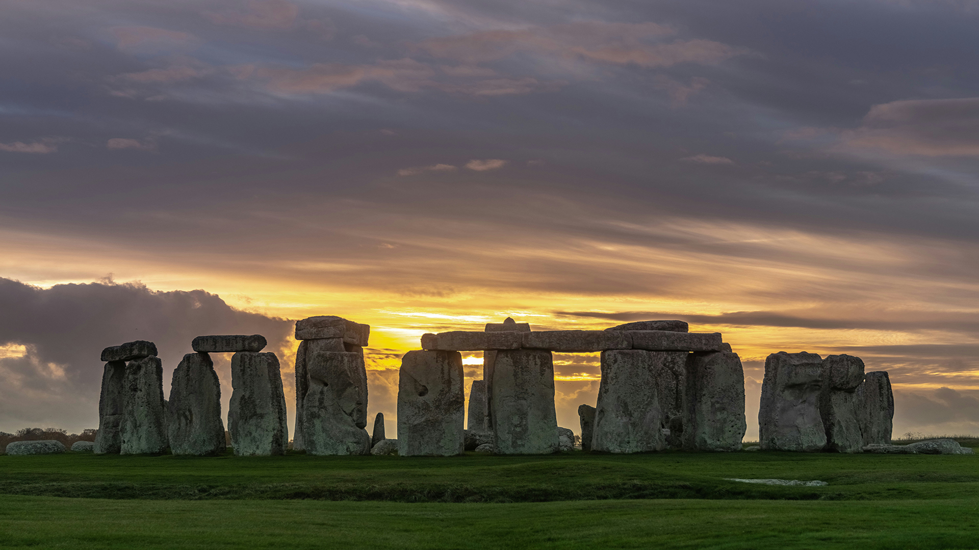 Enjoy the inner circle at Stonehenge. Image courtesy of Unsplash/Jack B. The stones at Stonehenge with the sun setting.