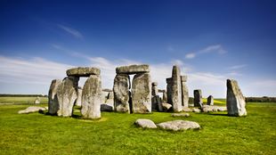 Stonehenge on a bright day with blue sky